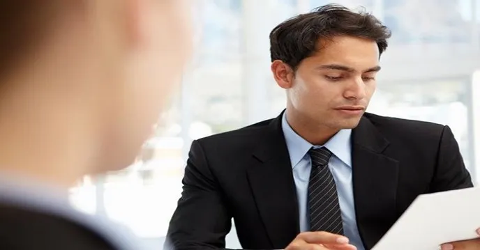 A client reviewing documents in a consultation
